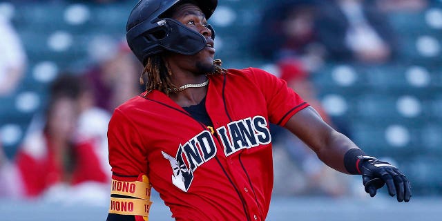 Indianapolis Indians infielder Oneil Cruz (15) watches his solo home run during a MiLB baseball game between the Louisville Bates and the Indianapolis Indians on May 7, 2022, at Victory Field in Indianapolis, IN 