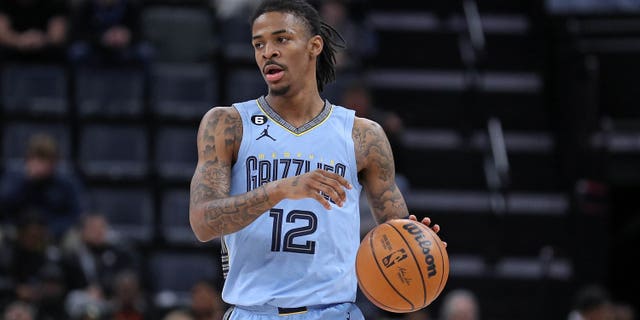 Ja Morant #12 of the Memphis Grizzlies handles the ball during the game against the Portland Trail Blazers at FedExForum on February 1, 2023 in Memphis, Tennessee.