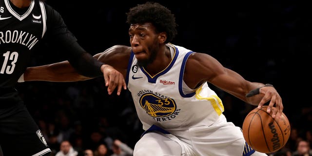 James Wiseman (33) of the Golden State Warriors in action against the Brooklyn Nets at Barclays Center on December 21, 2022 in New York City.