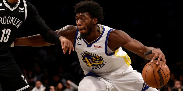 James Wiseman (33) of the Golden State Warriors in action against the Brooklyn Nets at Barclays Center on December 21, 2022 in New York City.