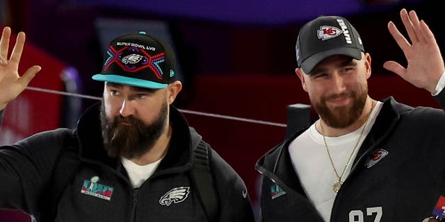 (L-R) Brothers Jason Kelce, #62 of the Philadelphia Eagles, and Travis Kelce, #87 of the Kansas City Chiefs, wave onstage during opening night of Super Bowl LVII presented by Fast Twitch at Footprint Center on February 6, 2023, in Phoenix, Arizona USA.