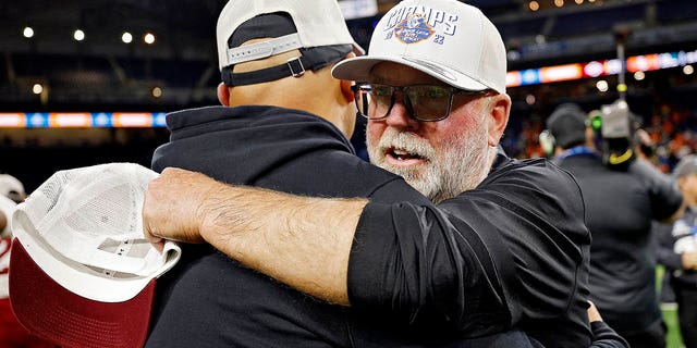 New Mexico State Aggies head coach Jerry Kill hugs an assistant coach after the Aggied defeated the Bowling Green Falcons, 24-19, in the Quick Lane Bowl at Ford Field on December 26, 2022 in Detroit, Michigan. 