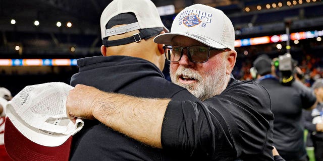 Jerry Kill head coach of the New Mexico State Aggies hugs an assistant coach after the Aggied defeated the Bowling Green Falcons, 24-19, in the Quick Lane Bowl at Ford Field on December 26, 2022 in Detroit, Michigan.