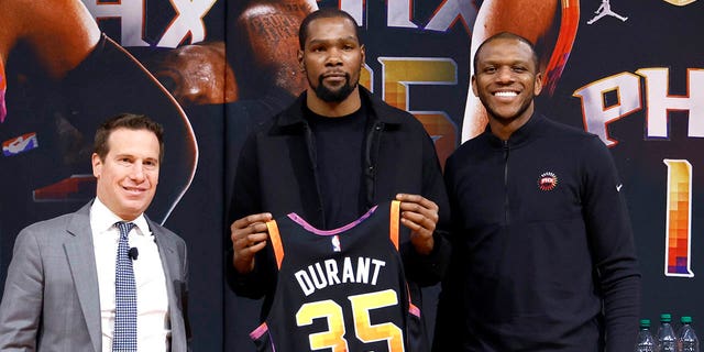(L-R) Phoenix Suns owner Mat Ishbia, Kevin Durant and general manager James Jones pose for a photo at a news conference at the Footprint Center on February 16, 2023 in Phoenix, Arizona. 
