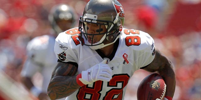 Kellen Winslow, #82 of the Tampa Bay Buccaneers, rushes after a catch during the season opener against the Detroit Lions at Raymond James Stadium on September 11, 2011, in Tampa, Florida.