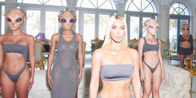 Kim Kardashian's fans were suspicious after she released her new alien-themed SKIMS swimwear ads amid recent UFO sightings.