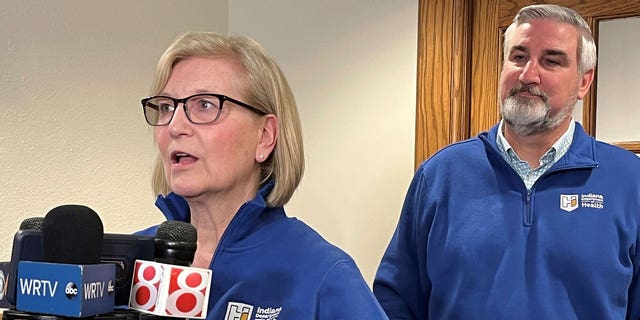 Indiana State Health Commissioner Dr. Kristina Box speaks alongside Gov. Eric Holcomb on the proposed expansion of the state's public health infrastructure