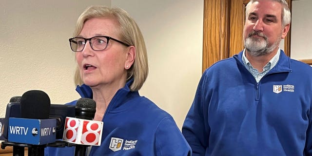 Indiana State Health Commissioner Dr. Kristina Box speaks alongside Gov. Eric Holcomb on the proposed expansion of the state's public health infrastructure