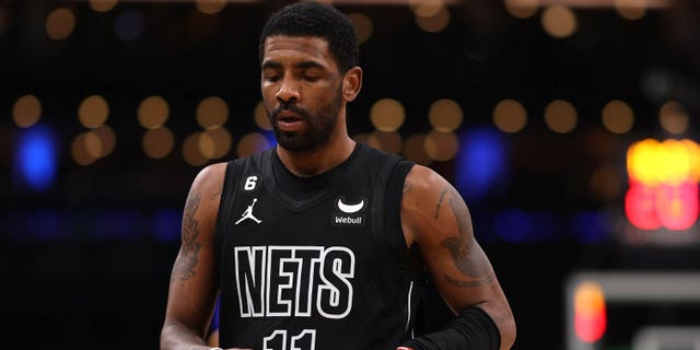 Kyrie Irving of the Brooklyn Nets looks on during the Celtics game at the TD Garden on February 1, 2023 in Boston.