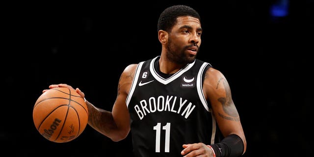 Kyrie Irving of the Brooklyn Nets dribbles during the second half against the Los Angeles Lakers at Barclays Center on January 30, 2023, in the Brooklyn borough of New York City.