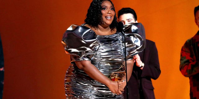 Lizzo accepts the Record Of The Year award for "About Damn Time" 