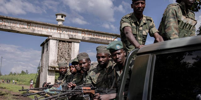 Congo’s M23 soldiers leave Rumangabo camp on Jan. 6, 2023. The militia gang raped women and killed at least 20 men at the end of November, according to Amnesty International. 