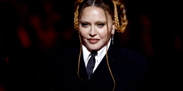 Madonna addresses the plastic surgery rumors that began after her appearance at the 2023 Grammy Awards.