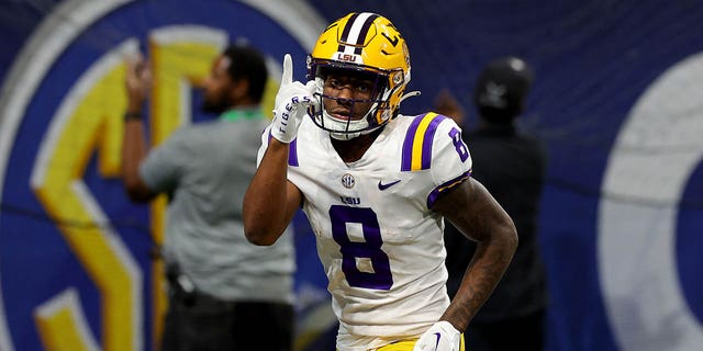 Malik Nabers of the LSU Tigers celebrates after scoring a 34-yard touchdown against the Georgia Bulldogs during the third quarter in the SEC championship game at Mercedes-Benz Stadium Dec. 3, 2022, in Atlanta.