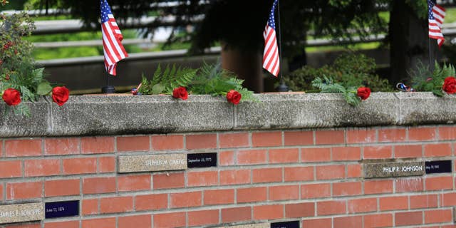 The Portland Police Bureau released a photo of what the memorial to fallen police officers at Tom McCall Waterfront Park looked like before it was vandalized.