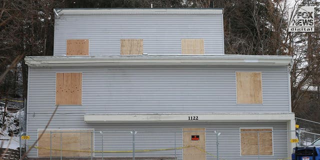 Exterior view of the home where the slaying of four University of Idaho students occurred is boarded up on Feb. 23, 2023.
