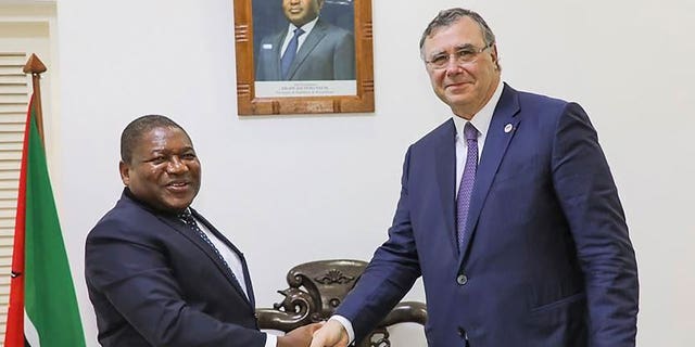 Mozambican President Filipe Nyusi shakes hands with TotalEnergies CEO Patrick Pouyanne.  Mozambique has become a hotbed for Islamic insurgents, some of whom killed a Médecins Sans Frontières representative after the NGO inspected the humanitarian situation in their region.