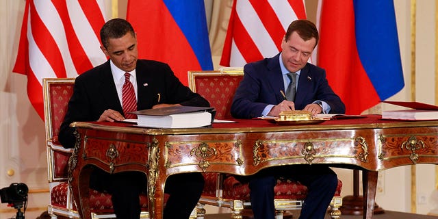 President Barack Obama, left, and Russian President Dmitry Medvedev sign the New START Treaty in Prague on April 8, 2010. NATO called on Russia on Feb. 3, 2023, to respect the treaty and urge Moscow to allow on-the-ground inspections.