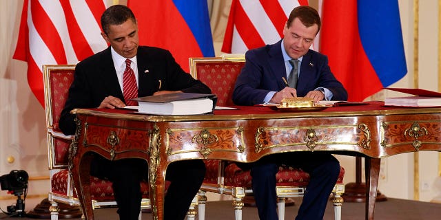 President Barack Obama, left, and Russian President Dmitry Medvedev sign the New START Treaty in Prague on April 8, 2010. NATO called on Russia on Feb. 3, 2023, to respect the treaty and urge Moscow to allow on-the-ground inspections.