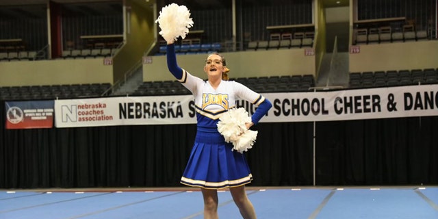 Katrina uses white cheerleading poms during her solo routine.