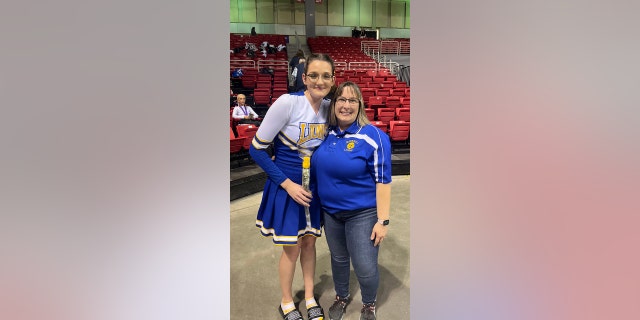 Katrina Kohel is pictured with her cheerleading coach, April Ott.