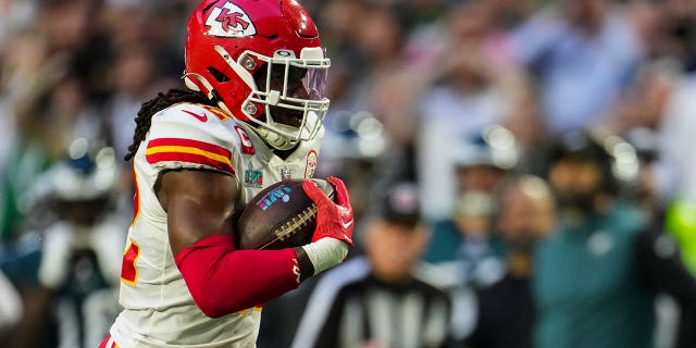 Nick Bolton #32 of the Kansas City Chiefs returns the fumble for a touchdown against the Philadelphia Eagles during the second quarter of Super Bowl LVII at State Farm Stadium on February 12, 2023 in Glendale, Arizona. 