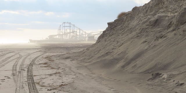 New Jersey environmental officials are fining the shore town of North Wildwood for its unpermitted expansion of existing sand dunes.