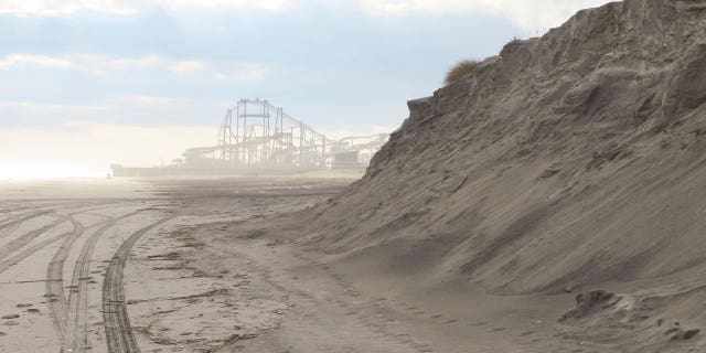 New Jersey environmental officials are fining the shore town of North Wildwood for its unpermitted expansion of existing sand dunes.