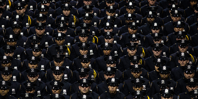New York City Police Academy cadets attend their graduation ceremony at the Barclays Center July 2, 2013, in the Brooklyn borough of New York City.