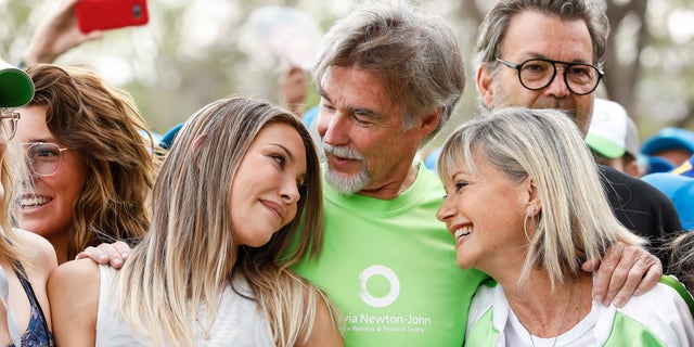 Olivia Newton-John, right, with daughter Chloe Lattanzi and husband John Easterling.