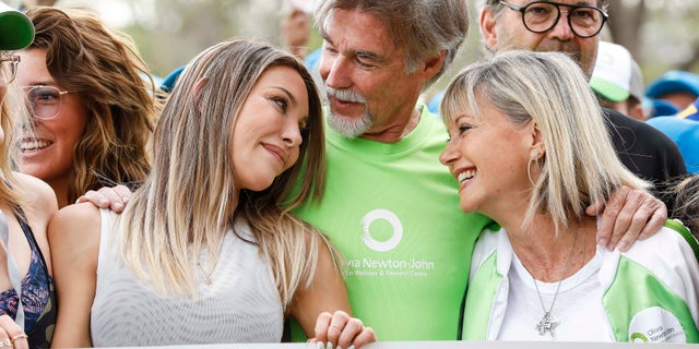 Olivia Newton-John, right, with daughter Chloe Lattanzi and husband John Easterling.