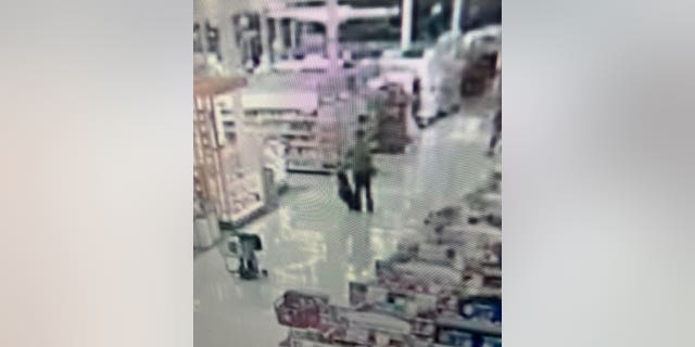Joseph Jones seen taking off his jacket in the Target store at 17810 West Center Road in Omaha, Nebraska.