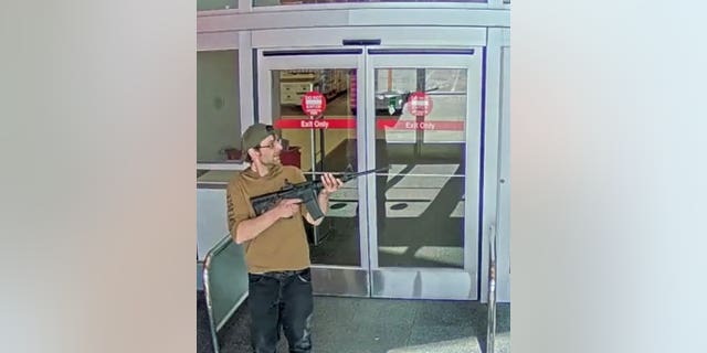 Joseph Jones seen pointing a rifle outside the Target store at 17810 West Center Road in Omaha, Nebraska.