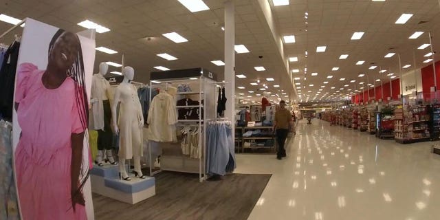 Joseph Jones walks shotgun in the aisles of the Target store at 17810 West Center Road in Omaha, Nebraska.