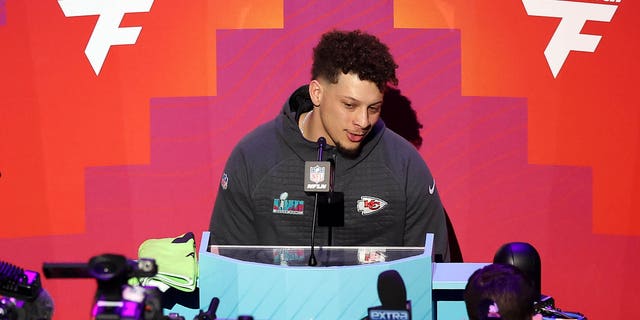 Patrick Mahomes #15 of the Kansas City Chiefs speaks to the media during Super Bowl LVII Opening Night presented by Fast Twitch at Footprint Center on February 06, 2023, in Phoenix, Arizona.