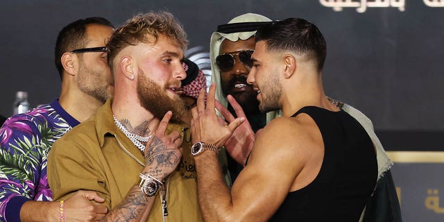 Jake Paul and Tommy Fury, right, clash during a press conference on February 23, 2023 in Riyadh, Saudi Arabia. 