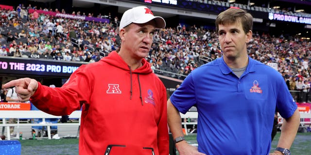 NFC head coach Eli Manning, right, and AFC head coach Peyton Manning speak during the 2023 NFL Pro Bowl Games at Allegiant Stadium on February 5, 2023 in Las Vegas.