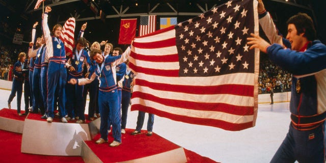 The American hockey team celebrates its gold medal victory over Finland with an impromptu display during presentation ceremonies at the Olympic Arena, Feb. 24, 1980.