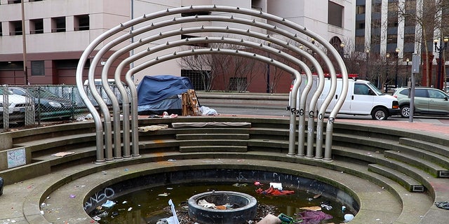 Trash fills a fountain in Portland on Feb. 17, 2023. The city has been suffering increasing rates of property crime for the past three years.