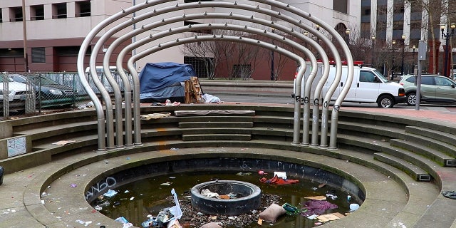 Trash fills a fountain in Portland on Feb. 17, 2023. The city has been suffering increasing rates of property crime for the past three years.