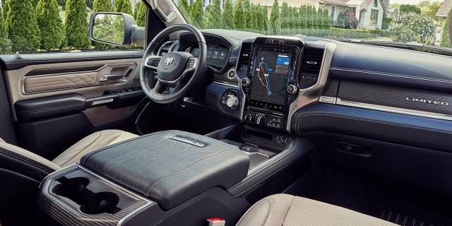 The interior of the internal combustion engine-powered 2023 Ram 1500 Limited Elite has a dashboard that is similar to the Ram 1500 REV's, but cannot be equipped with a passenger side screen.