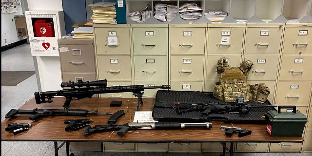 A man who allegedly made violent threats was arrested and investigators found a cache of guns and ammunition in his Hollywood high-rise apartment on Feb. 1, 2023. The weapons found were taken to the Los Angeles Police Department.