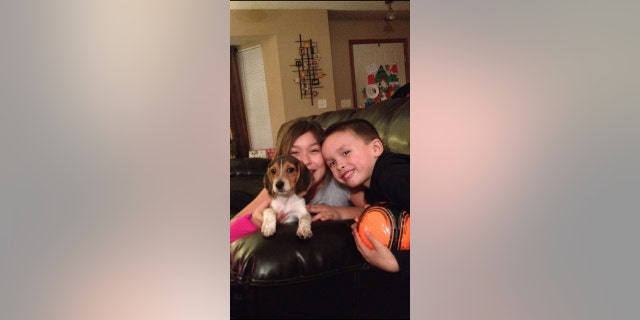Sister and brother Alani (left) and Alex (right) are seen in 2015. They were 8 and 5 years old when their mom brought home puppy Roscoe for them.