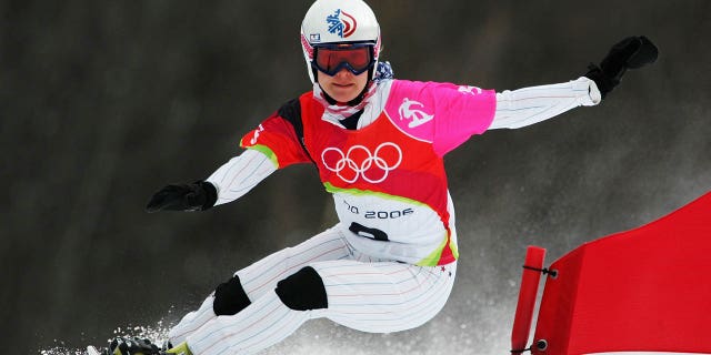 Rosey Fletcher of the USA competes her way to the bronze medal in the women's snowboarding parallel giant slalom final at the Turin 2006 Winter Olympics on February 23, 2006, in Bardonecchia, Italy.  