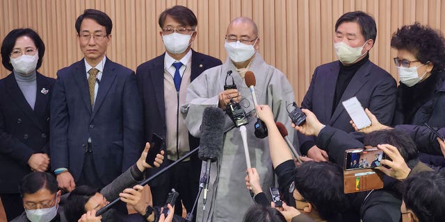 A South Korean court ruled that a 14th-century Korean Buddhist statue should be sent back to a Japanese temple where it was stolen in 2012. South Korean Buddhist monk Woonou speaks to the media outside the court in Daejeon, South Korea, on Feb. 1, 2023.