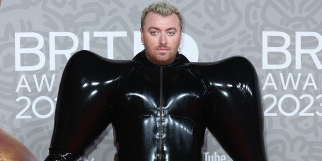 Sam Smith commanded attention with their bold look on the red carpet at the 2023  BRIT Awards.