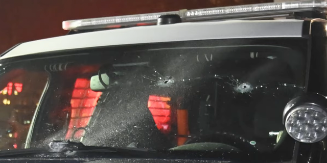 San Jose PD patrol car with bullet holes. 