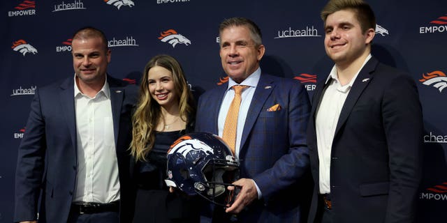 New Denver Broncos head coach Sean Payton poses with Christopher Titone and family members Meghan Payton and Connor Payton during a press conference at the UCHealth Training Center on February 6, 2023 in Englewood, Colorado.