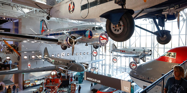 Patrons visit the Smithsonian's National Air and Space Museum for the public reopening of the museum’s west end galleries on the National Mall in Washington, U.S. October 14, 2022. 