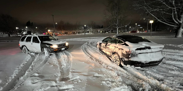 Cars are trapped on an icy road in Portland, Oregon.